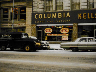 old image of columbia storefront sale sign